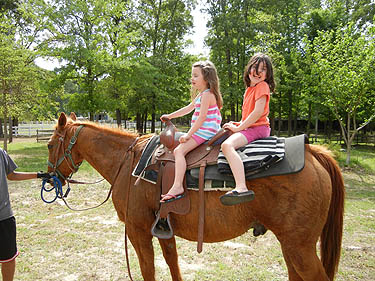 Little Annie and her big sister Carrie.  Annie is 6 yrs old with Autism.  She is a Sweetheart!